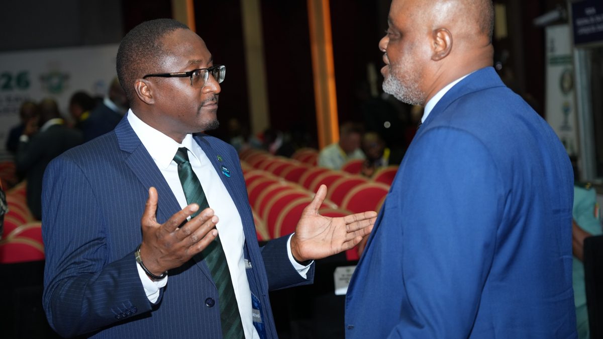 Two delegates in conversation at a conference